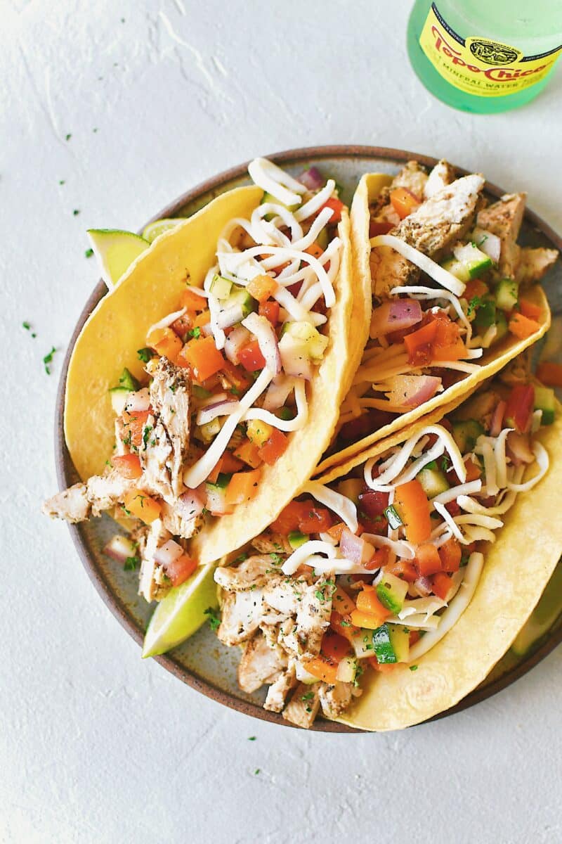 Greek Pico on top of Greek Chicken Tacos.