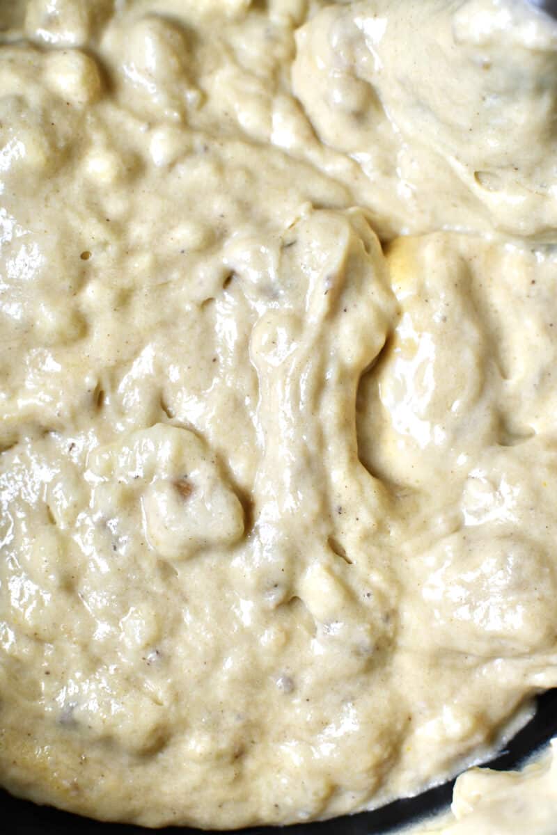 Banana bread batter after mixing in all the dry ingredients and walnuts