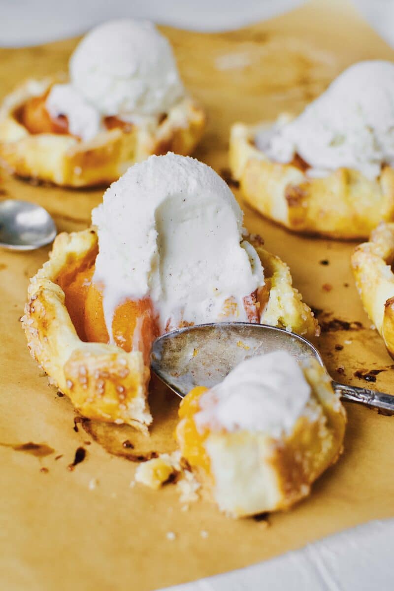 Apricot Pies fresh out of the oven, topped with vanilla ice cream.