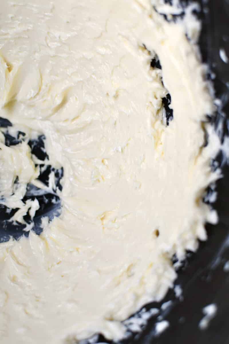 Fresh butter whipped in the bowl of a stand mixer.