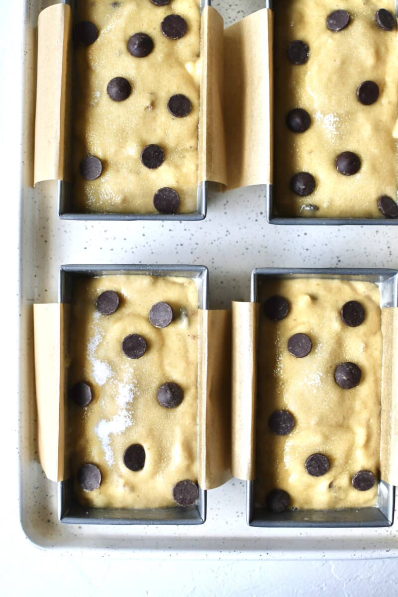 Banana bread batter in mini loaf pans.