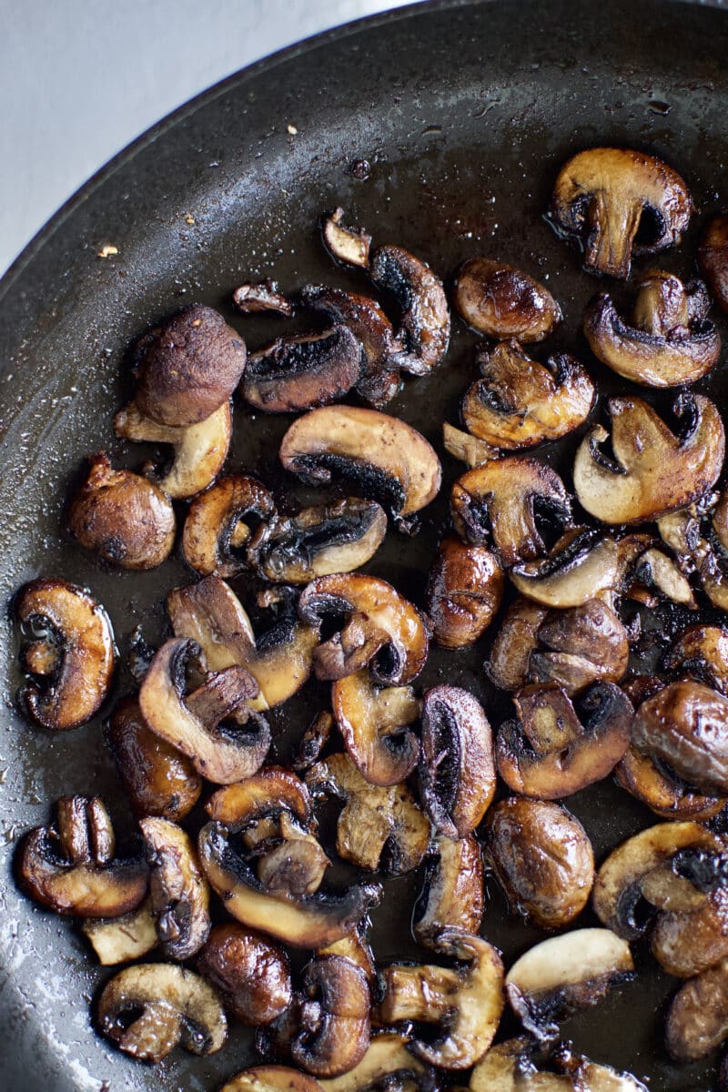 Browned mushrooms in a pan.