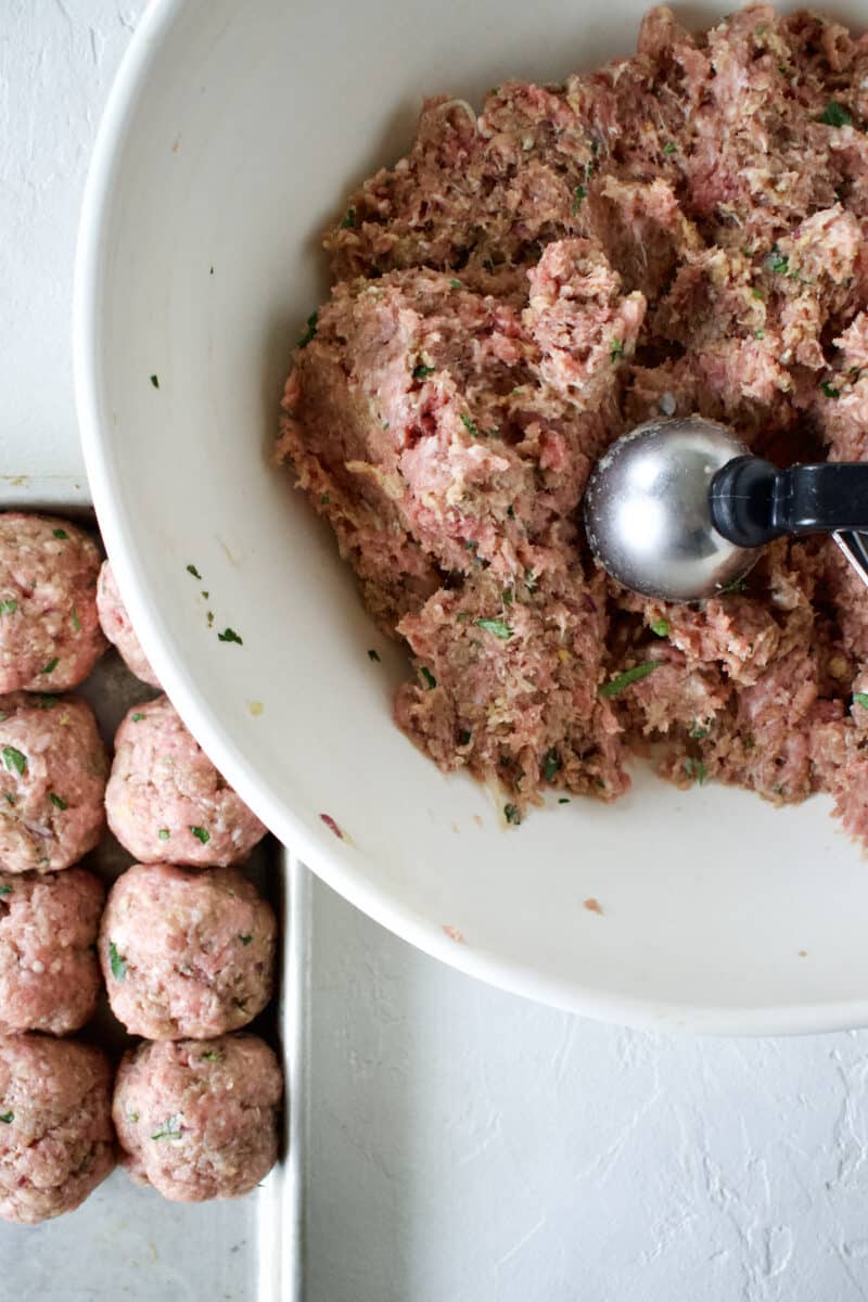 Forming the greek meatballs.