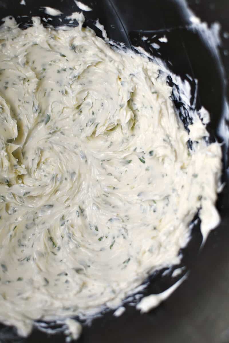 Fresh butter whipped in the bowl of a stand mixer. Garlic, and parsley added.