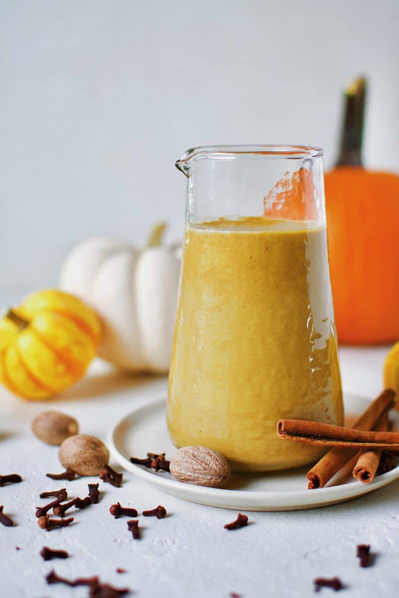 Sugar-Free Pumpkin Spice Syrup  in a carafe ready for morning coffee to make a homemade Pumpkin Spice Latte.