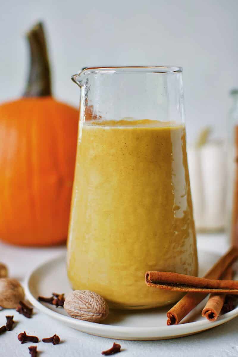 Sugar-Free Pumpkin Spice Syrup in a carafe ready for morning coffee to make a homemade Pumpkin Spice Latte.