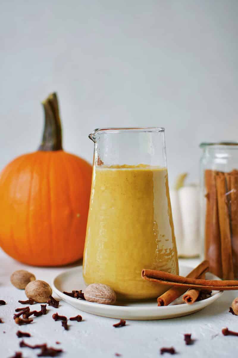 Sugar-Free Pumpkin Spice Syrup in a carafe ready for morning coffee to make a homemade Pumpkin Spice Latte.