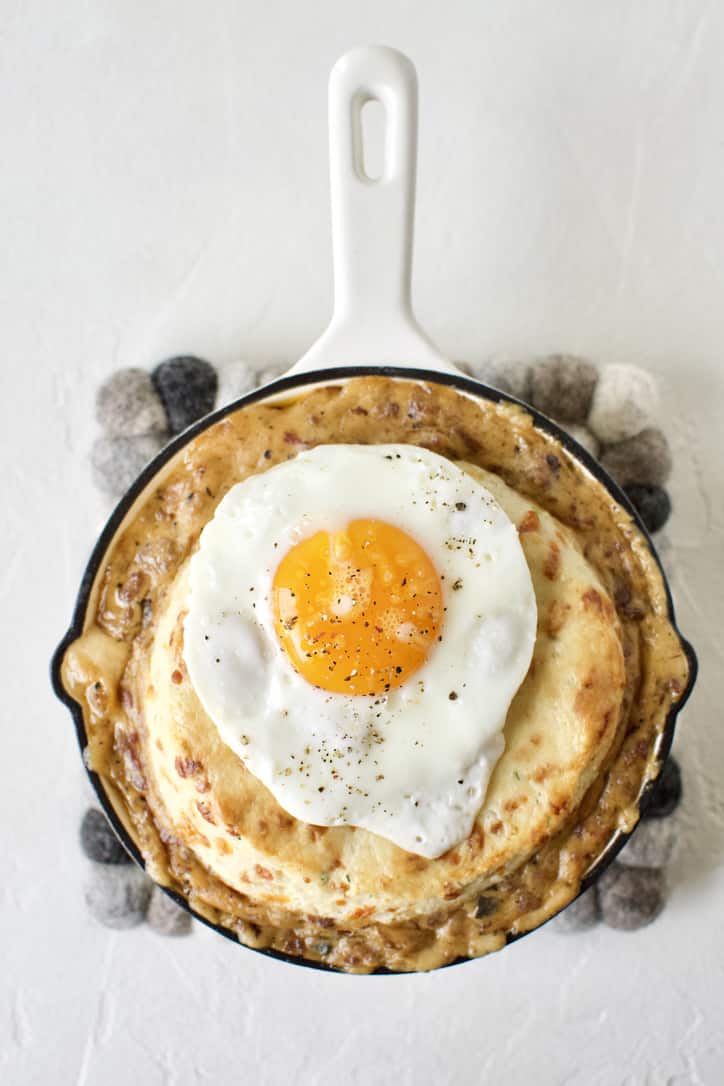 Breakfast Pie ready to eat. Topped with a fried egg.