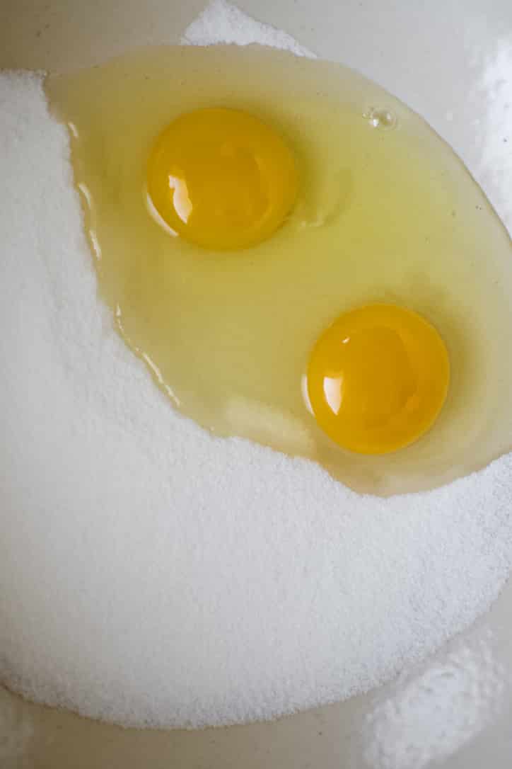 Eggs and Sugar in a bowl ready to be whisked together until foamy.