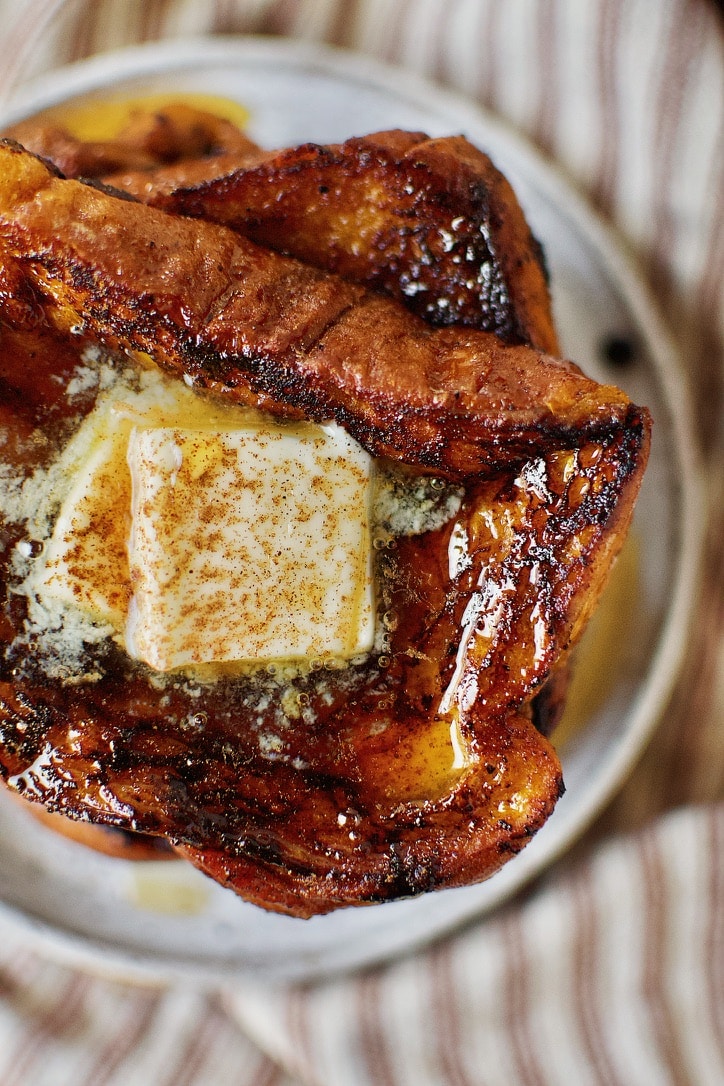 Pumpkin French Toast ready to eat topped with butter and pure maple syrup.