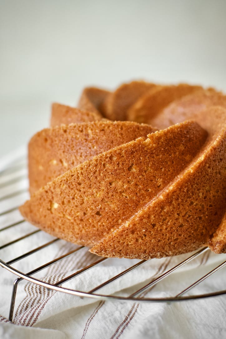 Apple Cider Donut Cake just unmolded after baking. Cooling on a wire rack.