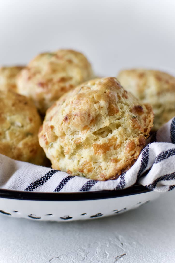 Finished biscuits in a towel lined bowl.