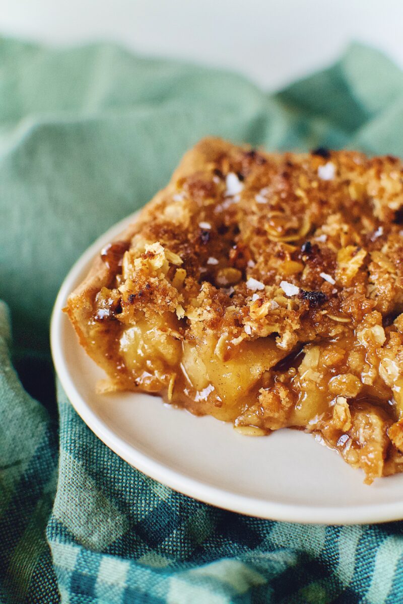 a slice of Honeycrisp Apple Slab Pie ready to eat.