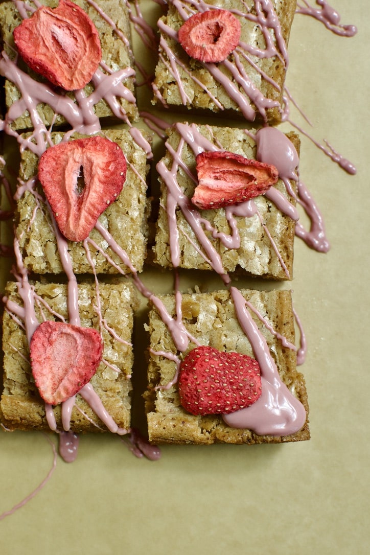 Ruby Chocolate Brownies ready to eat. Each square is topped with a freeze dried strawberry.