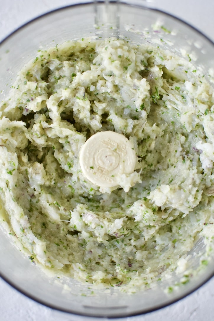 Blended parsley, garlic, and red onion in a food processor. Shrimp and bread crumbs added and pulsed together until blended.