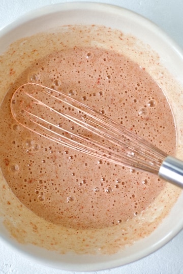 Whisking together the sugar and eggs for ruby chocolate brownies.