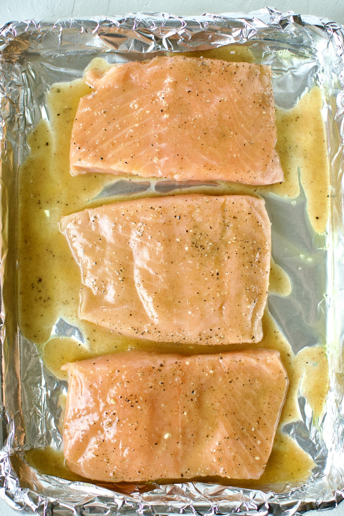 Salmon fillets with glaze on top.