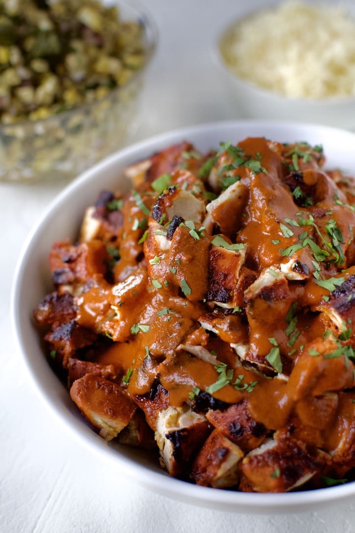 Finished Pollo Asado topped with extra marinade and garnished with cilantro.