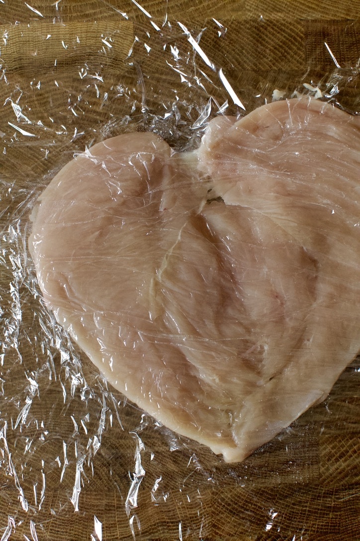 A split, tenderized, chicken breast.
