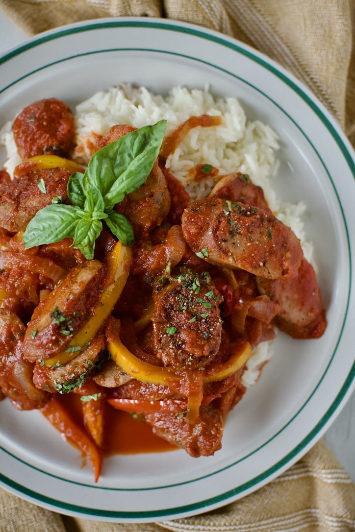 Italian Sausage and Peppers Recipe on a plate, ready to eat. Served over rice.