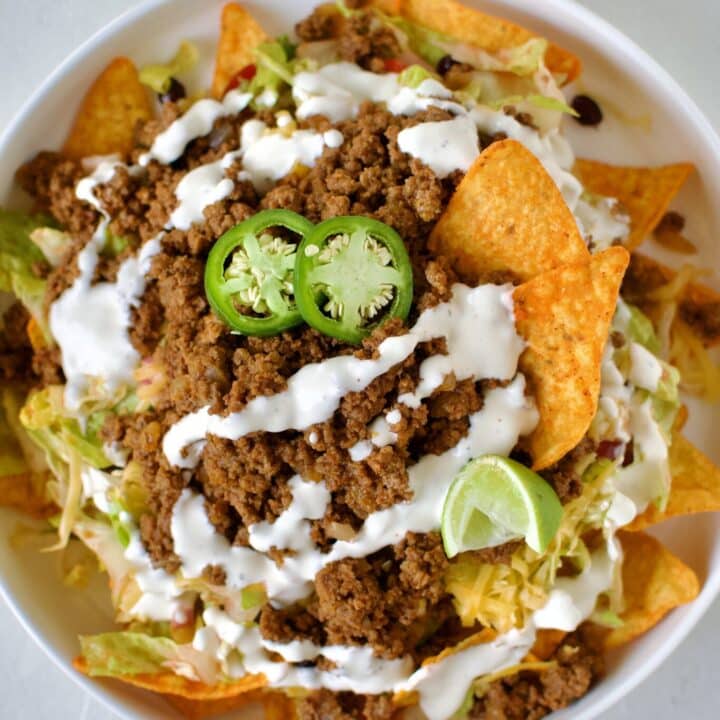 Taco Salad Recipe with Doritos on a large plate ready to eat.