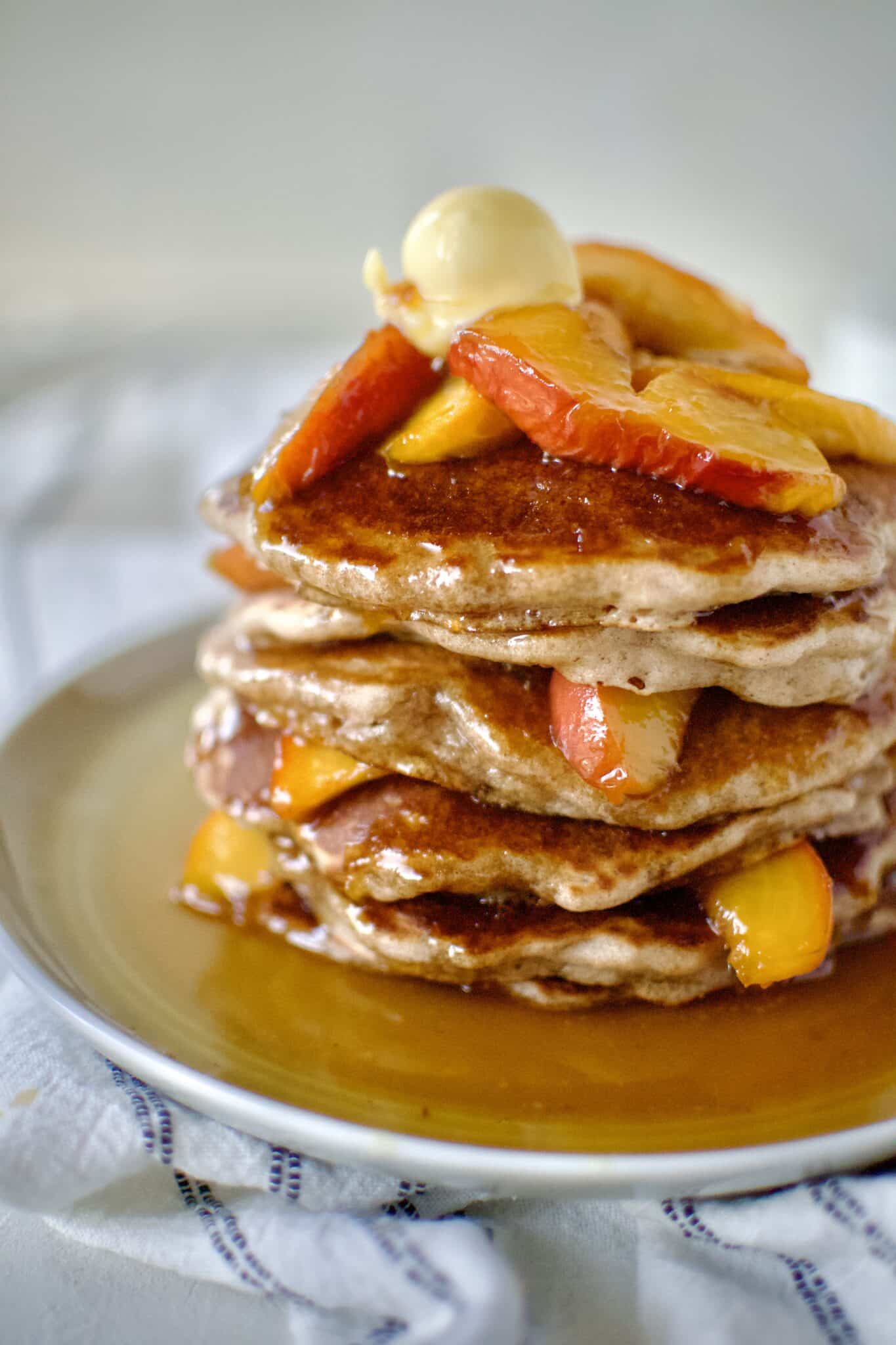 Peach Pancakes on a plate ready to eat.