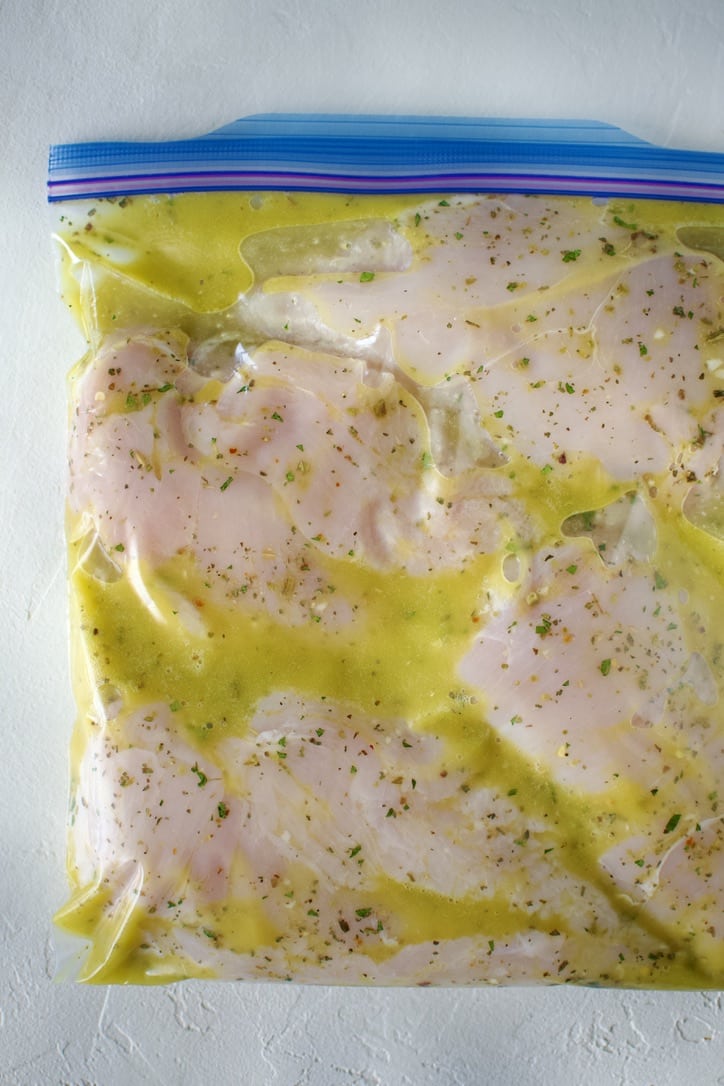 Italian Marinade in a bag with chicken breasts marinating.