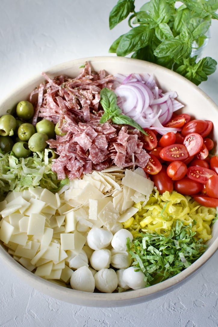 All ingredients for Italian Chopped Salad in a large bowl.