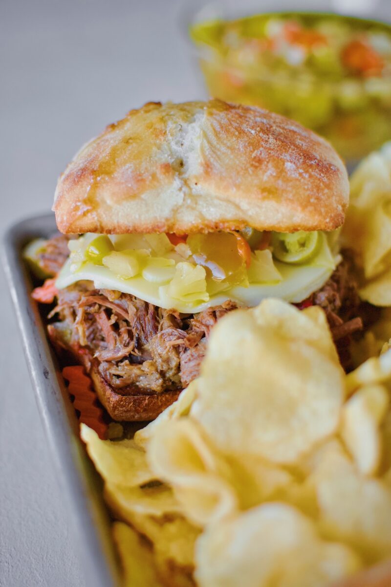 Chicago-Style Italian Beef Sandwiches Recipe on a platter with chips ready to eat.