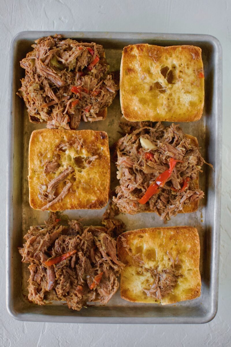 Italian Beef added to toasted ciabatta rolls.