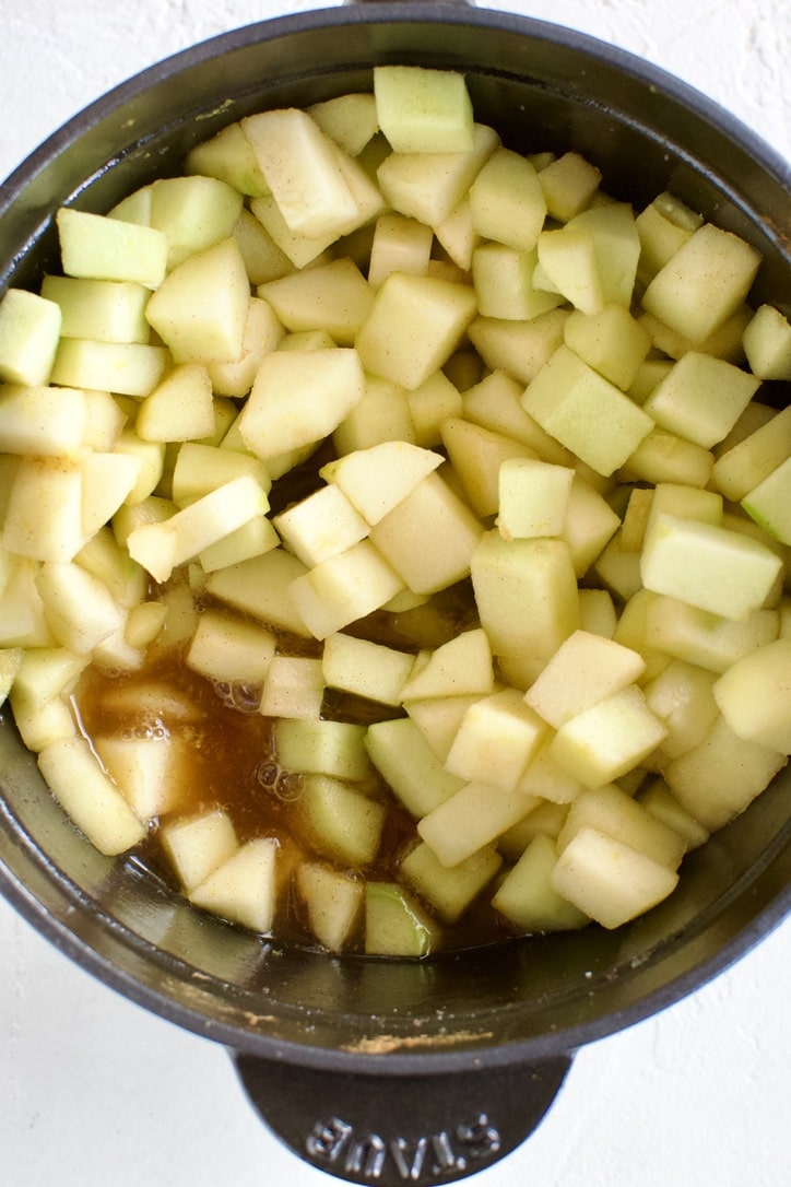 All of the ingredients for easy apple sauce in a pot. Stirred together.