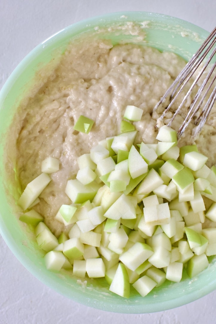 Mixing up the muffin batter and folding in the chopped apple.