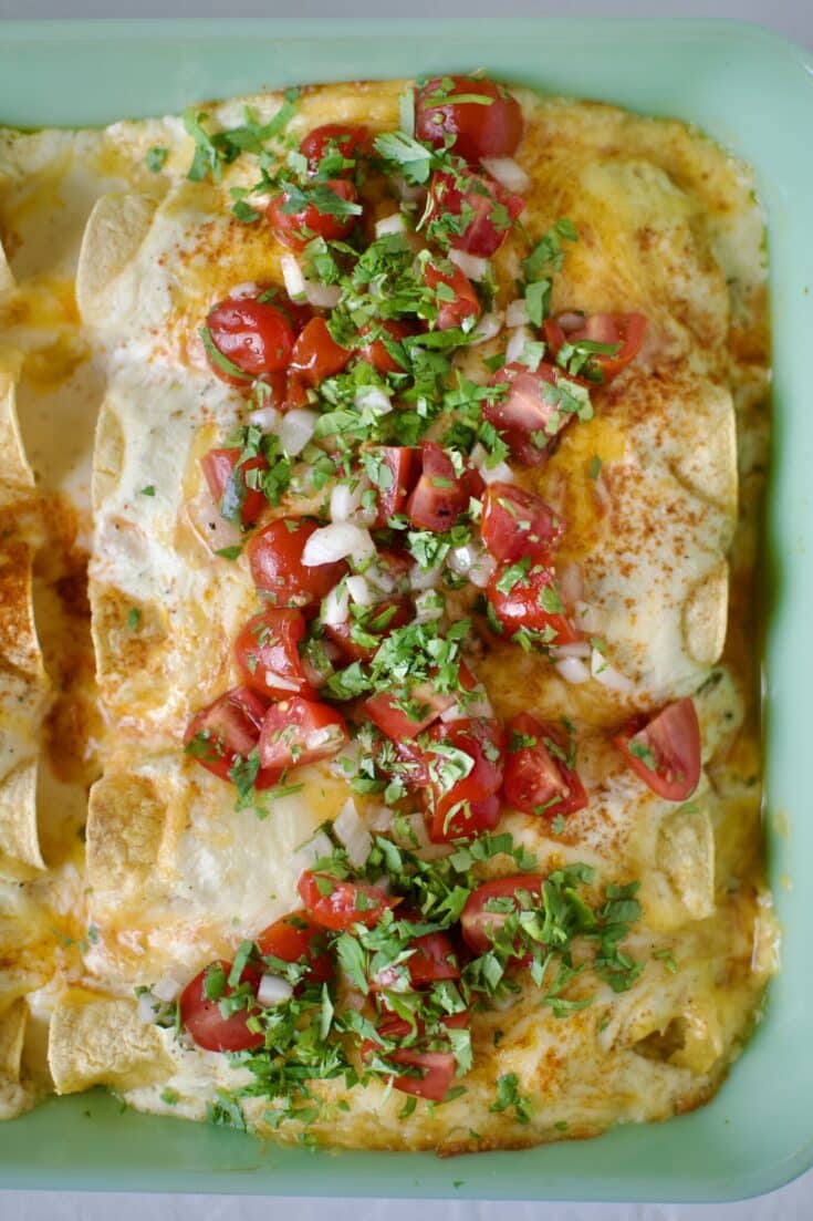 Chicken Enchiladas with Sour Cream Sauce after baking and topped with pico de gallo and cilantro.