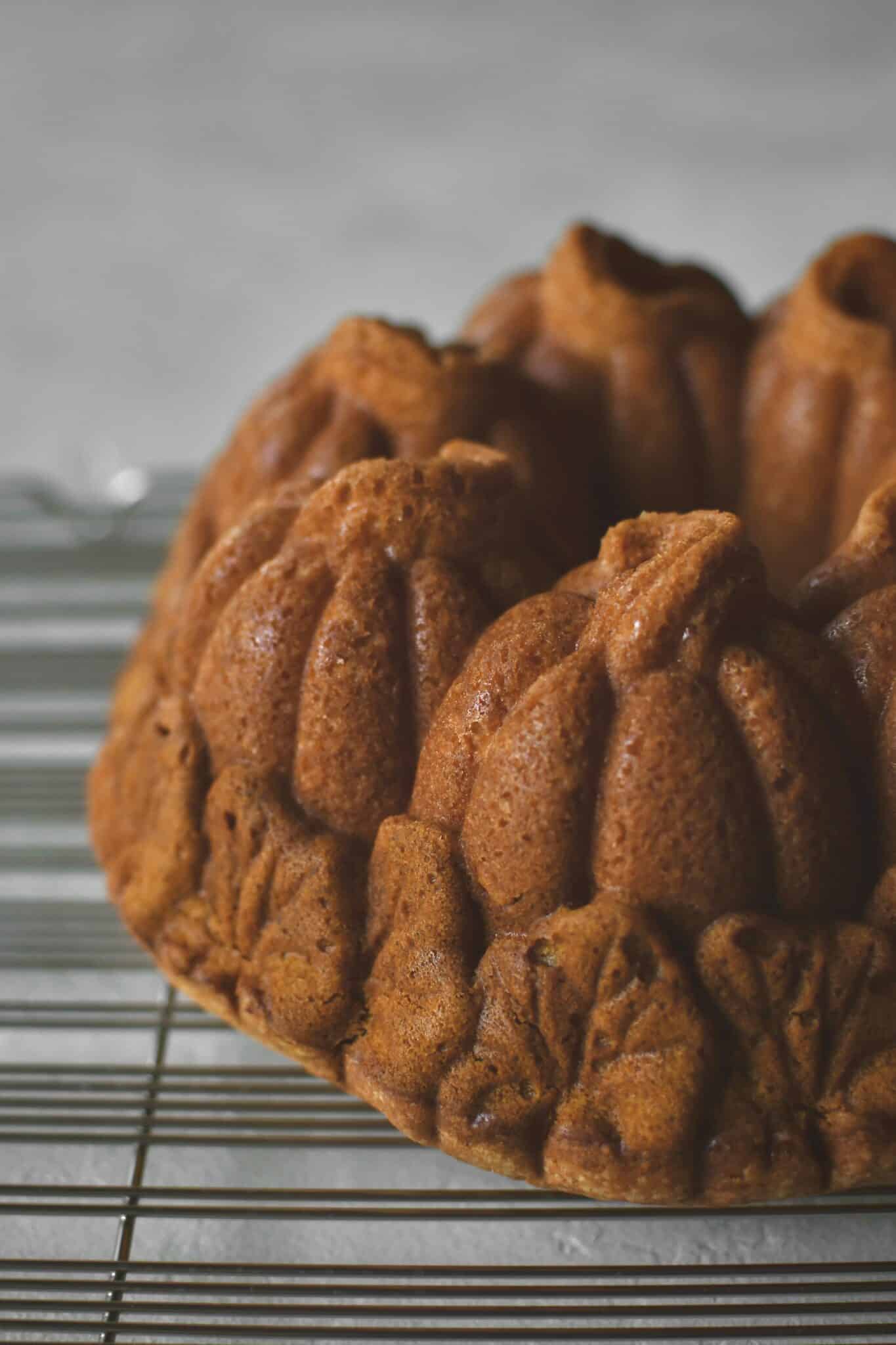 Pumpkin Pound Cake baked and removed from the bundt pan that looks like pumpkins in a field.