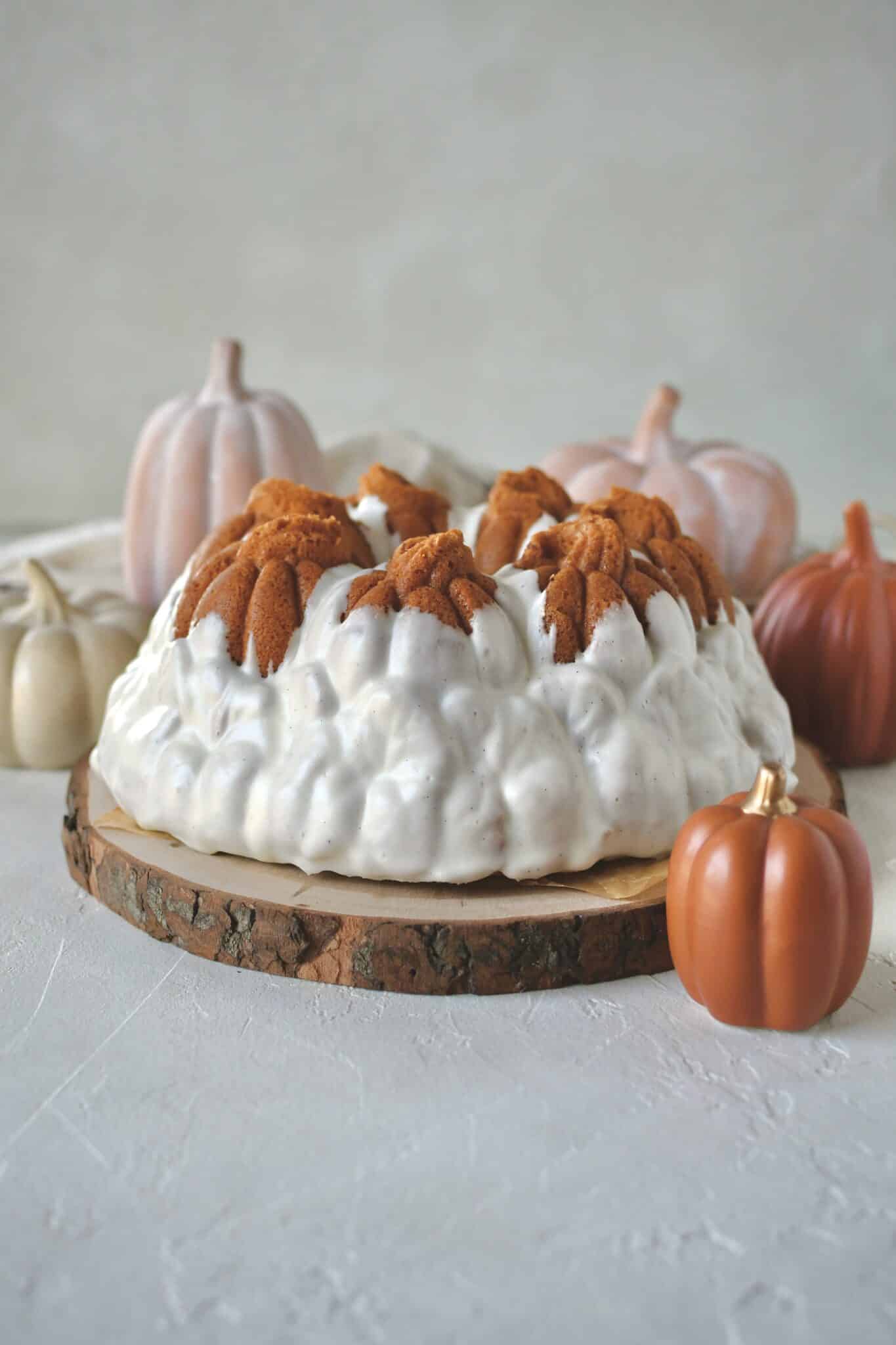 Pumpkin Pound Cake baked and removed from the bundt pan that looks like pumpkins in a field.