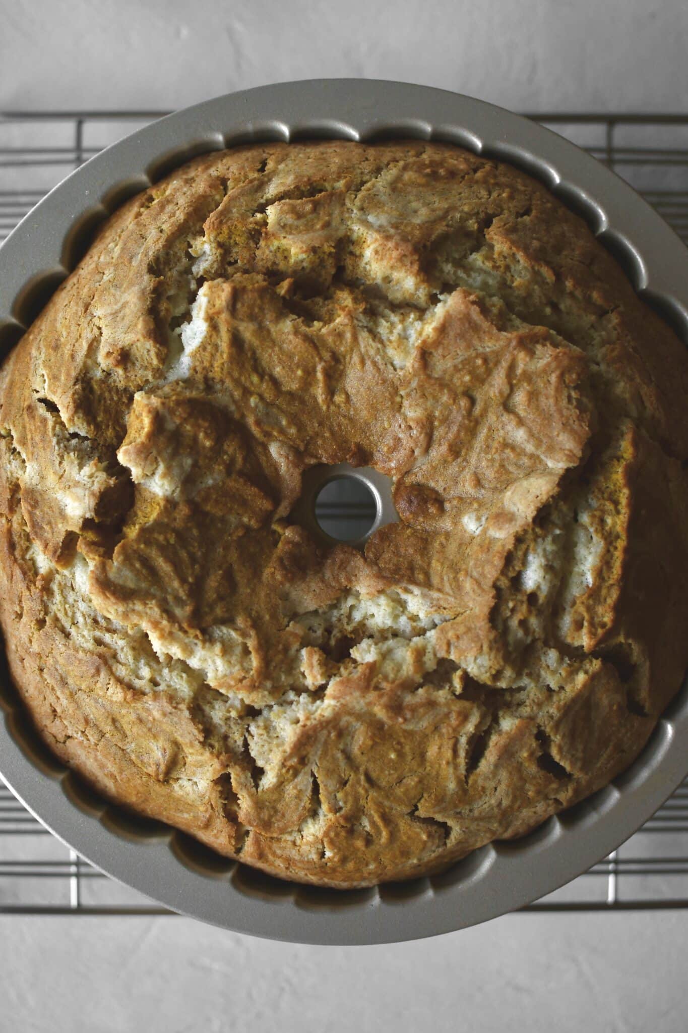 Baked cake removed from the oven and cooling in the pan.