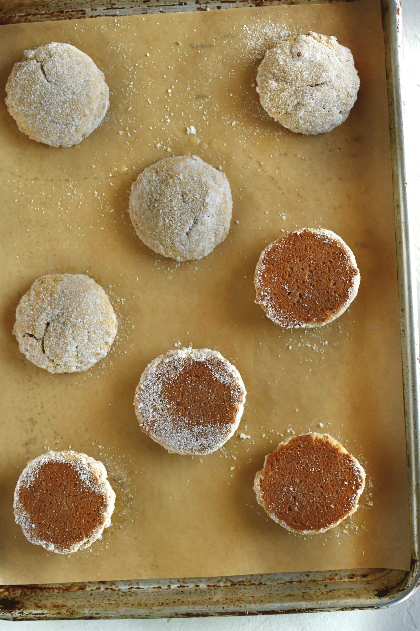 Whoopie pies ready to be filled with the cream, half turned over to be piped on.