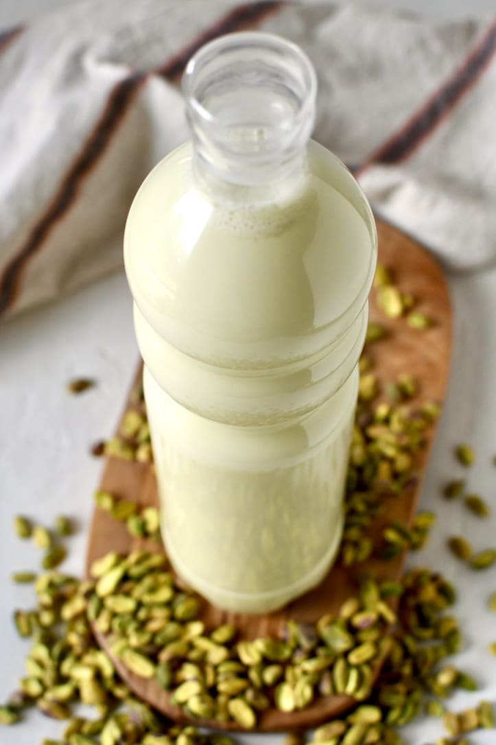 Finished pistachio milk in a glass jar ready to drink.