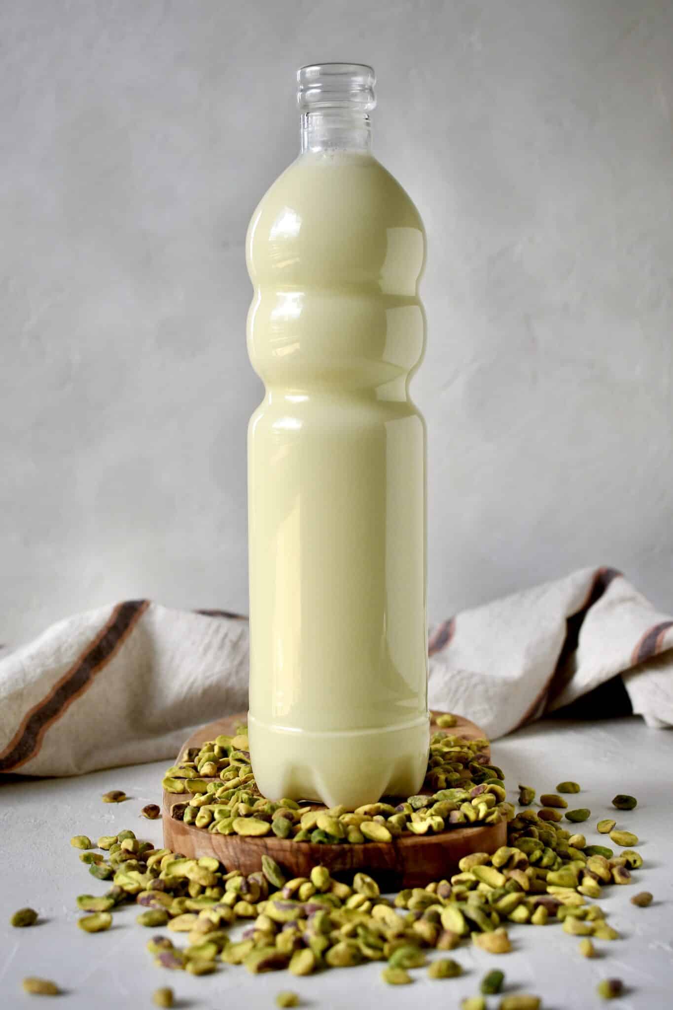 Finished pistachio milk in a glass jar ready to drink.