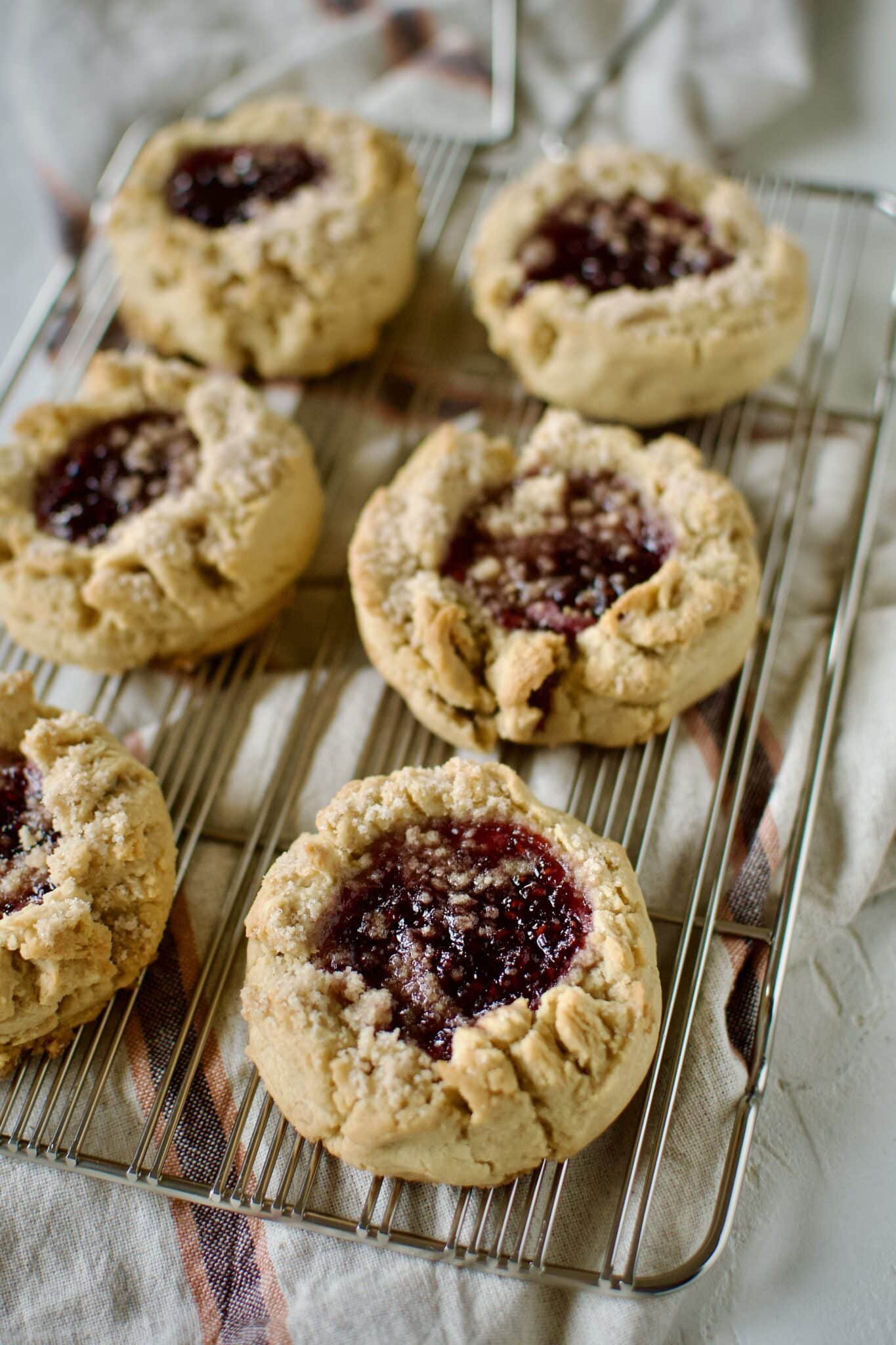 Peanut Butter and Jelly Cookies on a cooling rack.