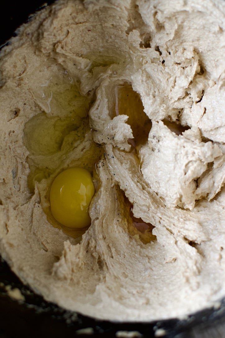 Creaming the cookie mixture together, while adding the egg.