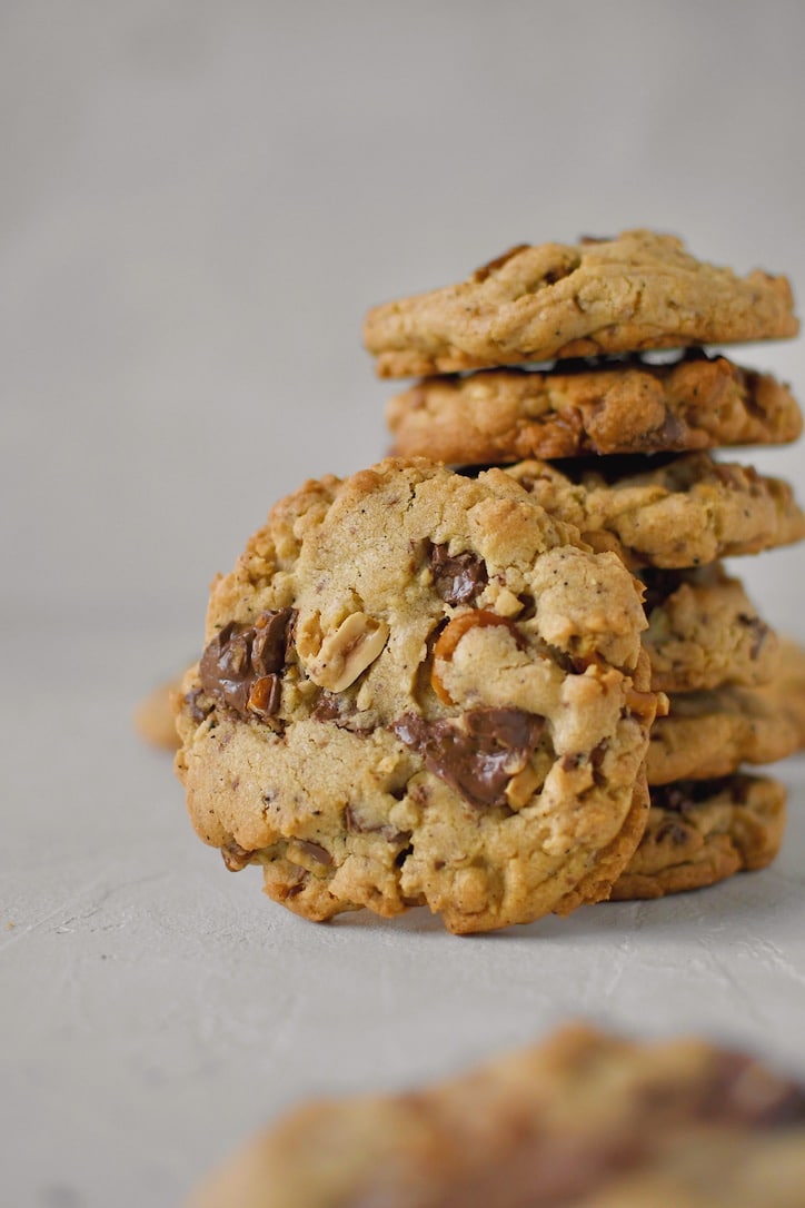 Kitchen Sink Cookies stacked up, with on showing in front.