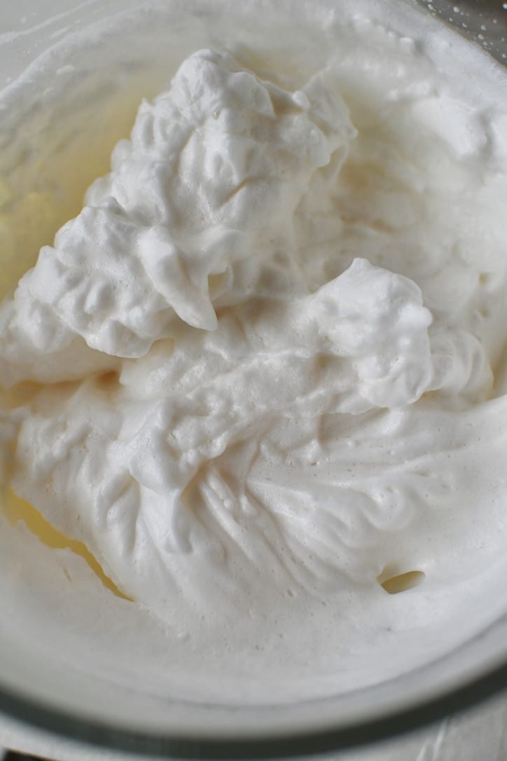 Whipped egg whites that have salt, vanilla, and almond extracts beat in.