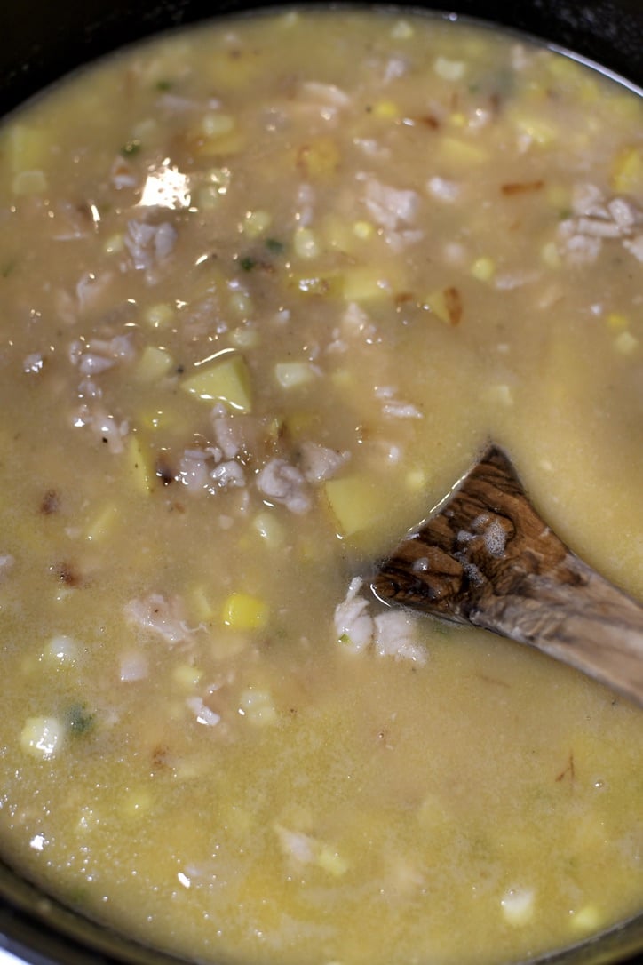 Chicken stock and bouillon added to the pot along with the potatoes.