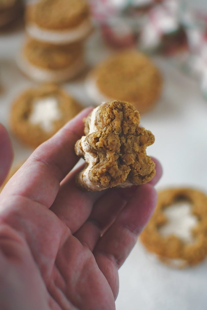Gingerbread Oatmeal Cream Pie cookie cut into the shape of gingerbread men and sandwiched together.