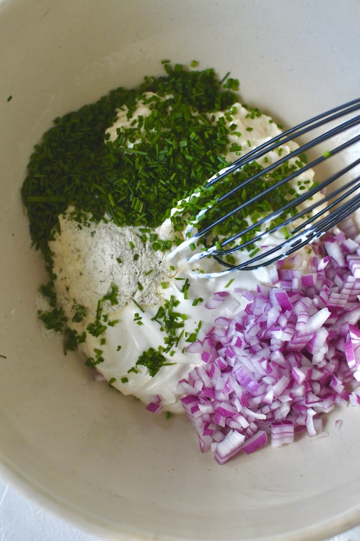 Mixing up the sauce for the potato salad.