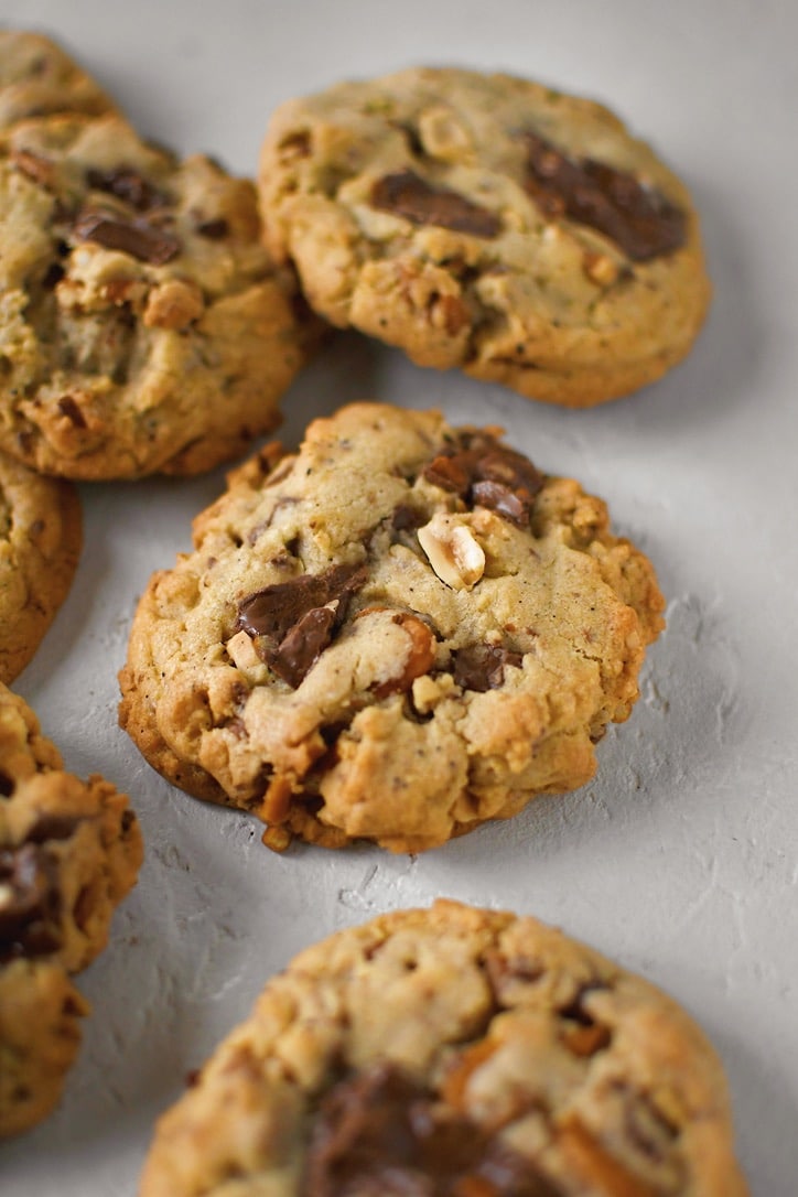 Kitchen Sink Cookies on a table cooling.