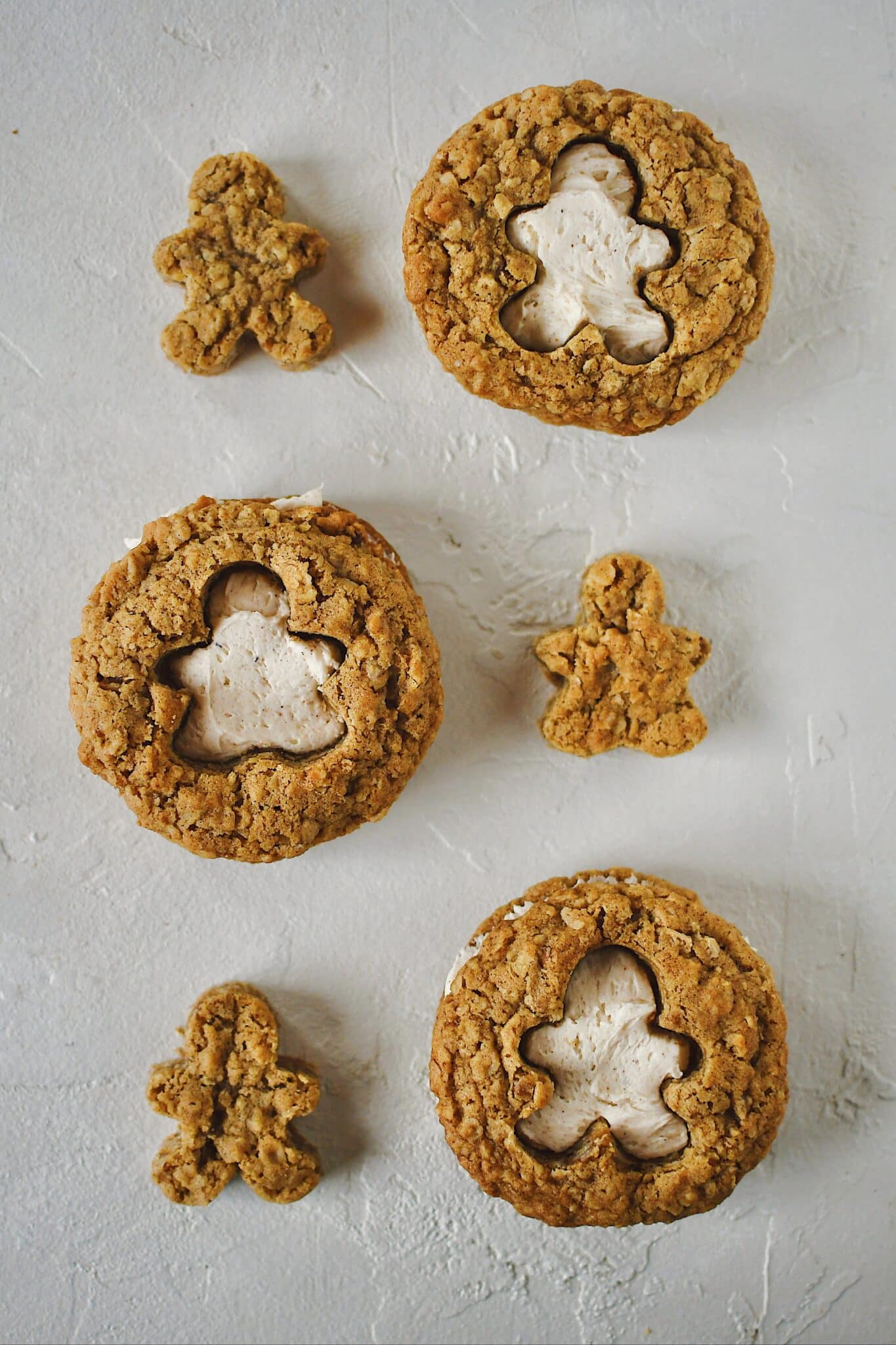 Gingerbread Oatmeal Cream Pie with the shape of gingerbread man cut out of one side and sandwiched together.