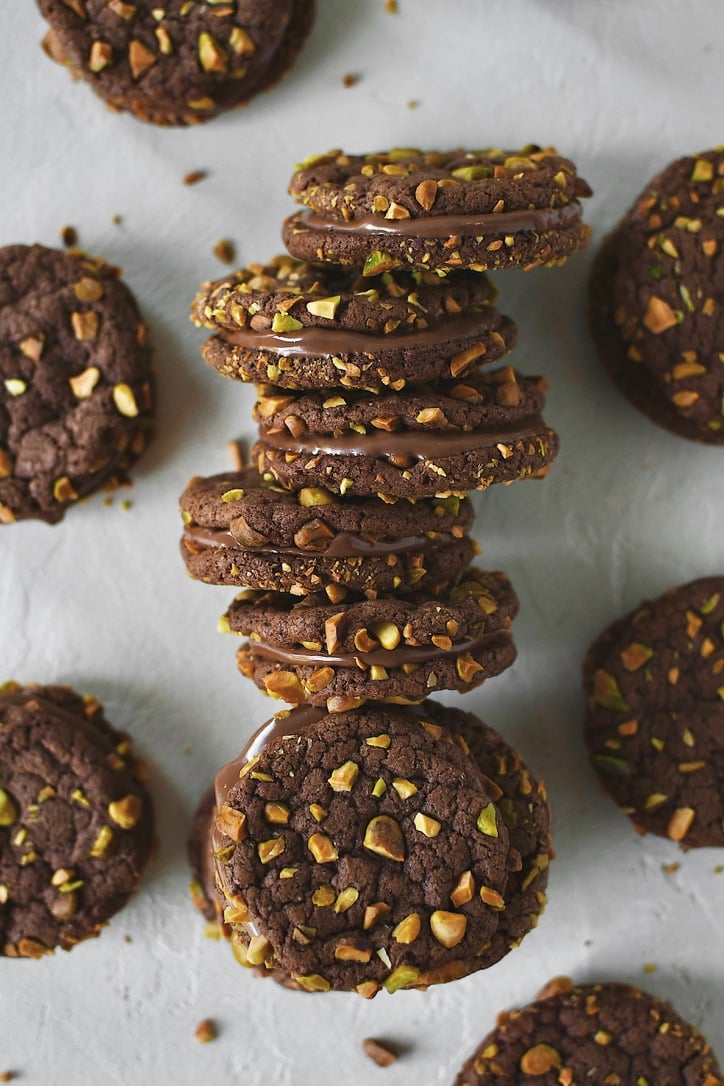 Finished Pistachio Cookies sandwiched together with nutella and stacked together.