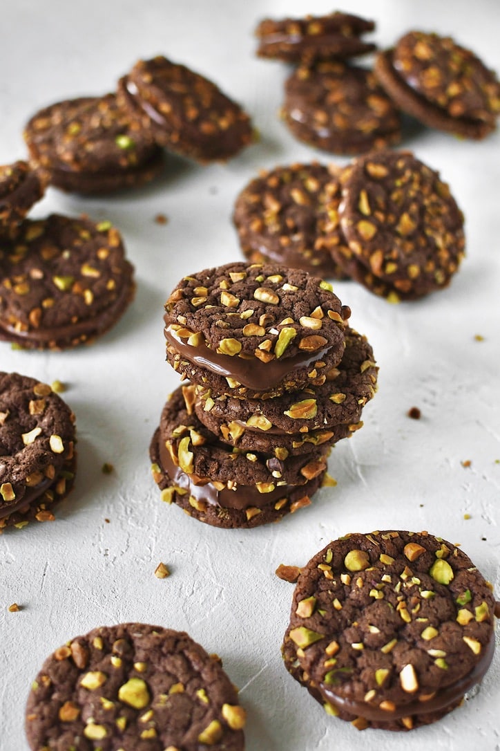 Finished Pistachio Cookies sandwiched together with nutella and stacked together.